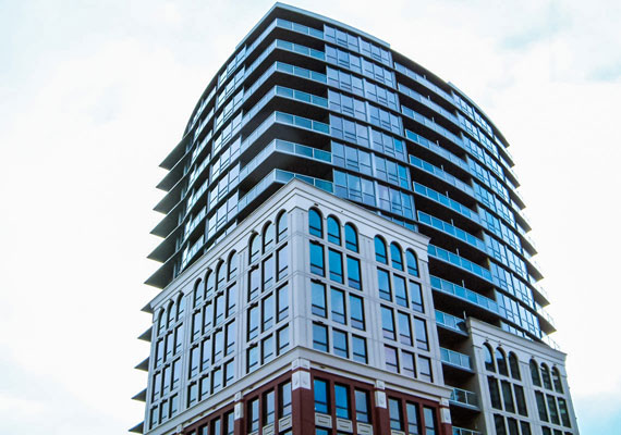 14 Begbie Street, New Westminster. New concrete and glass tower combined with a heritage style brick facade. 158 residential suites + 4 retail units.